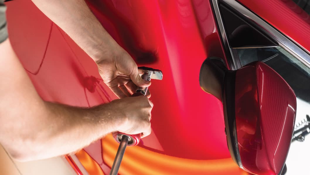 Paintless dent repair Houston TX Race Track Auto Center professional dent pulling services