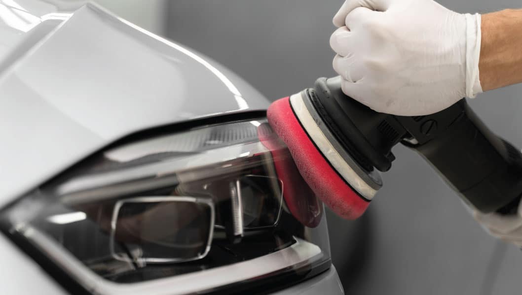 Professional headlight restoration Houston polishing UV protection Race Track Auto Center